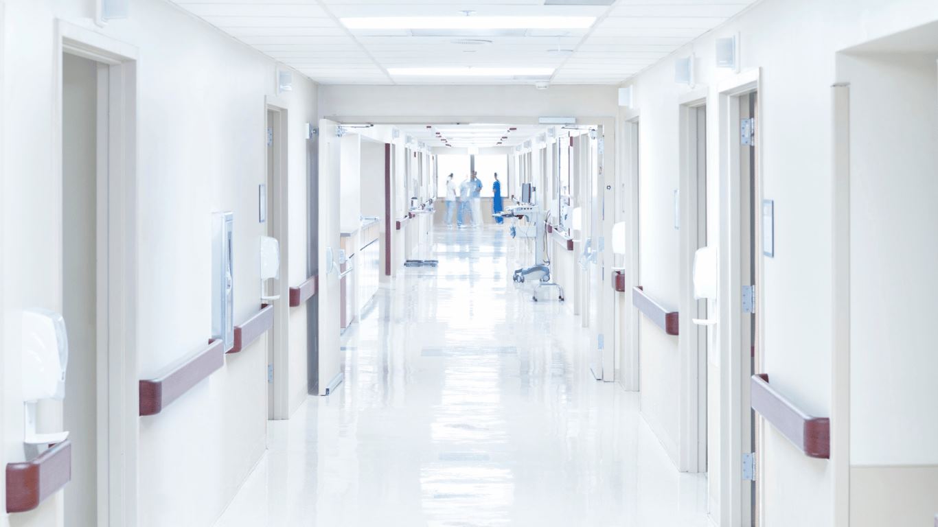 This image depicts a hospital hallway. At Bullock Law PC, we recently secured a multi-million dollar settlement due to negligence.